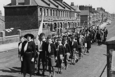 12th Woolwich Cub pack outside the East
Plumstead Baptist Church, corner of Griffin
& Brewery Roads, in preparation for their
annual St. Georges Day Parade march into
Woolwich, c.1954. Photo: Alan West. Alan West
is Standard Bearer. See story Memories of
Childhood and My Memories